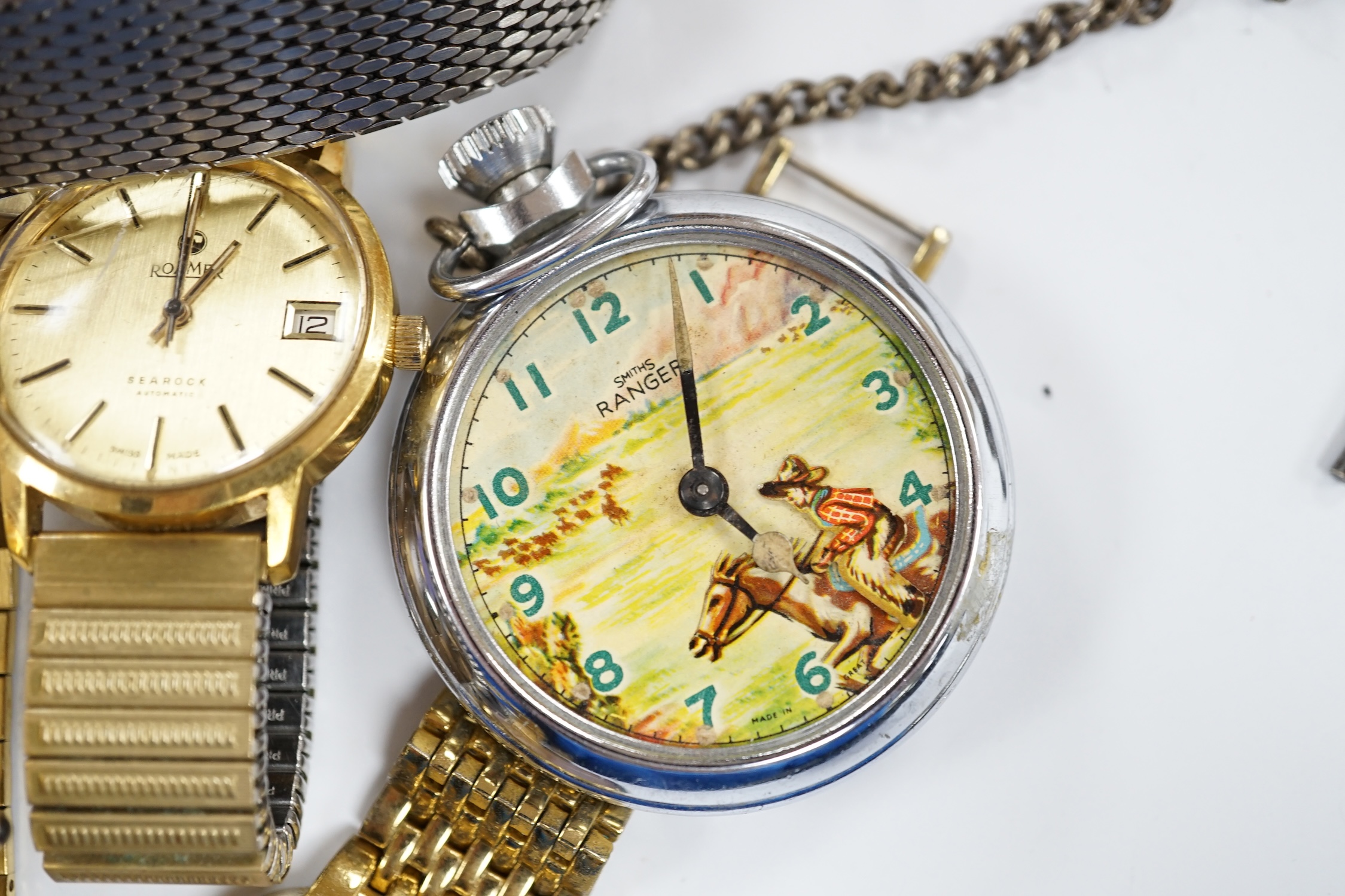 A small group of assorted wrist and pocket watches including a gold plated hunter and a Roamer Searock.